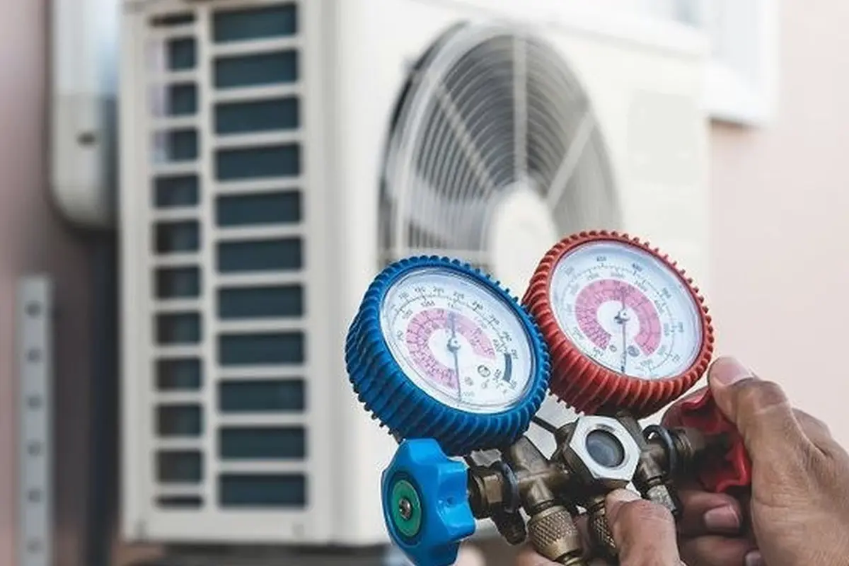 Emergency Central AC Repair in Capuchino San Bruno CA — refrigerant gauges during AC service