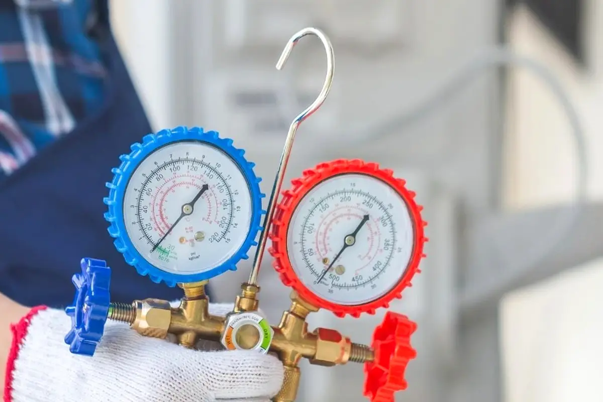 Frozen Evaporator Coil Repair in Crestmoor San Bruno CA — refrigerant gauges during AC service