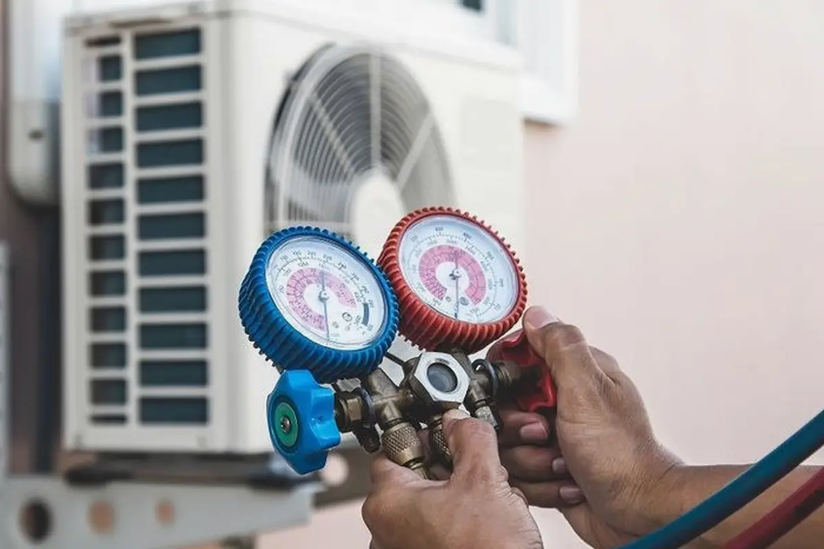Frozen Evaporator Coil Repair in Portola Highlands San Bruno CA — refrigerant gauges during AC service