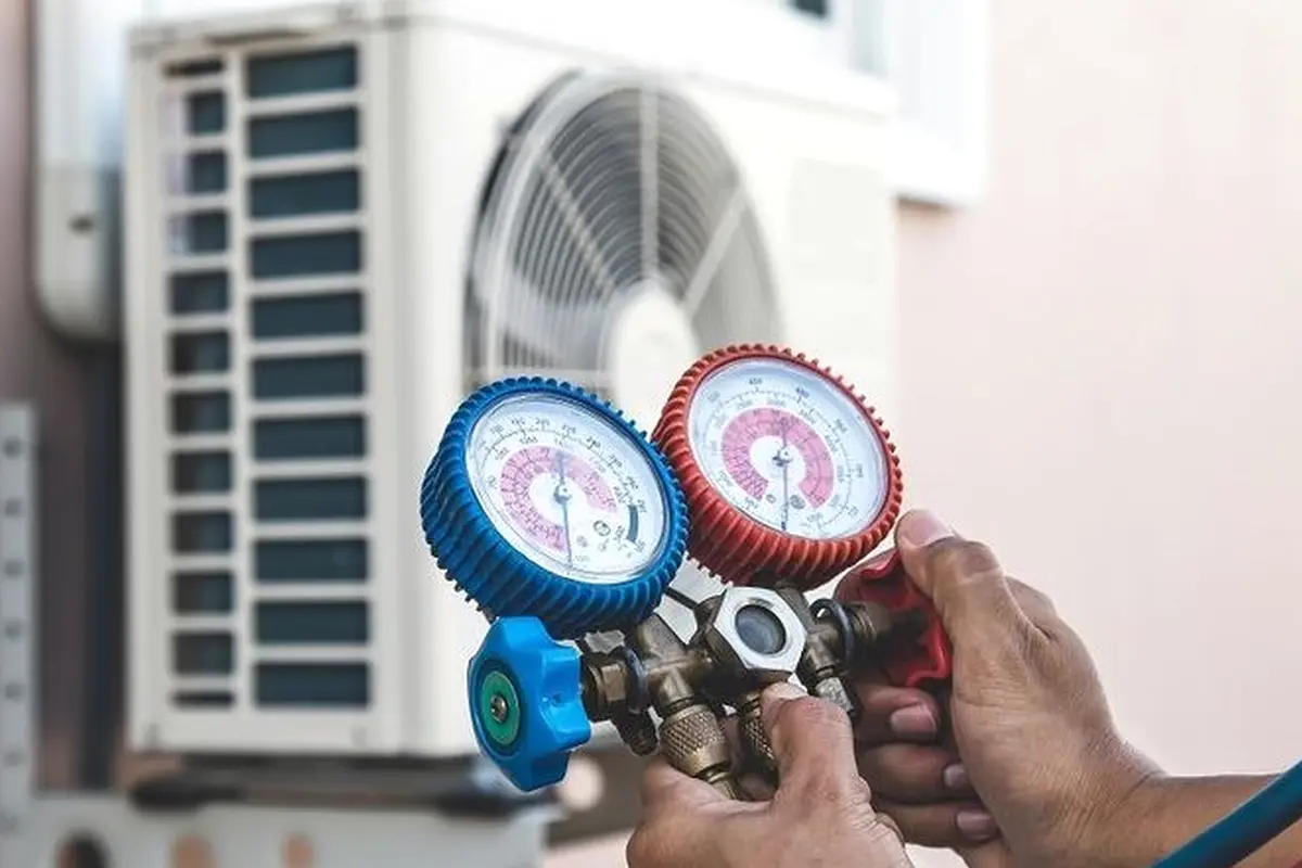 Frozen Evaporator Coil Repair in Rollingwood San Bruno CA — refrigerant gauges during AC service