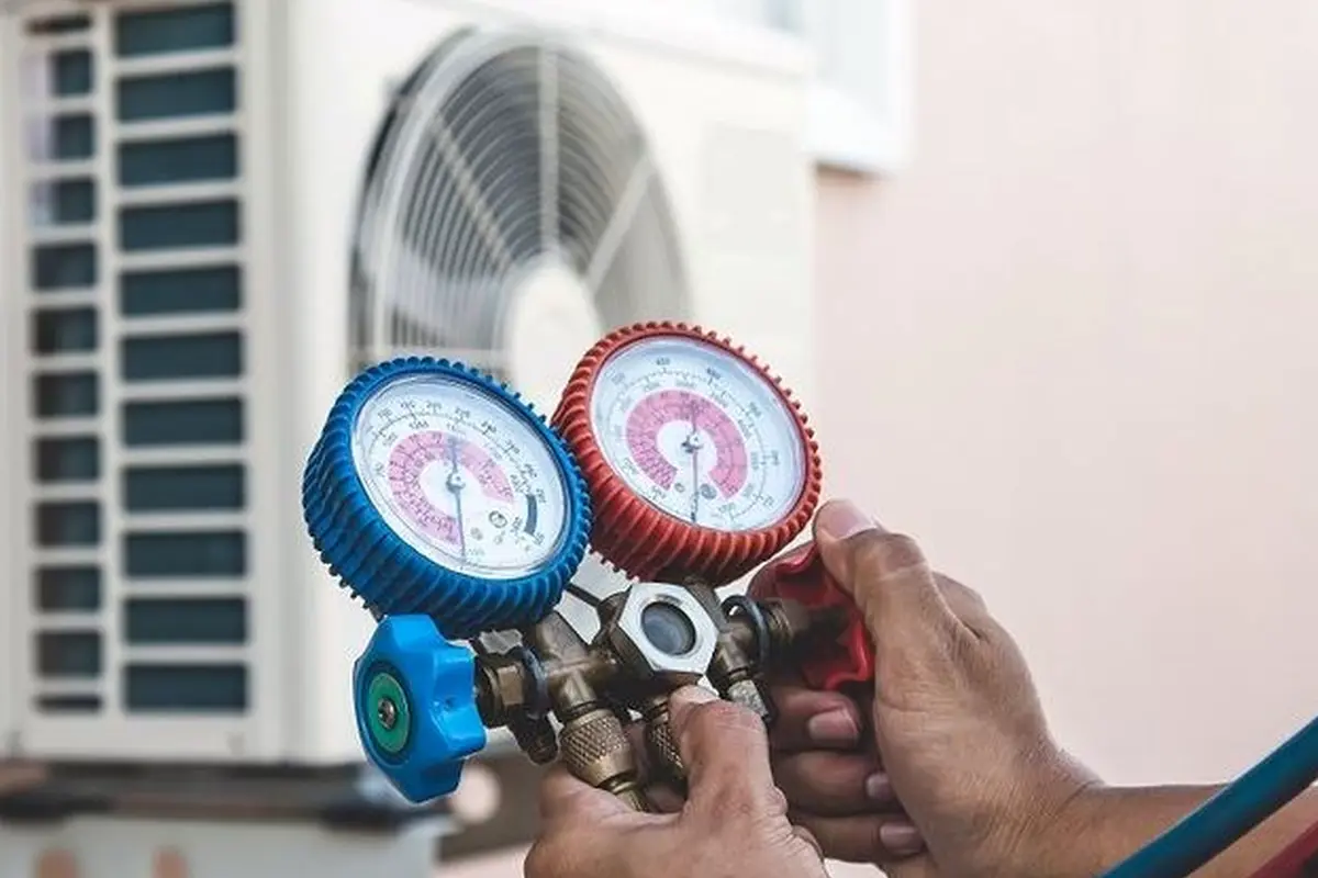 Frozen Evaporator Coil Repair in San Bruno Park San Bruno CA — refrigerant gauges during AC service
