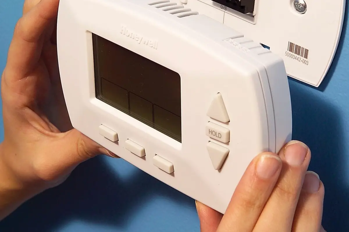Thermostat Repair Replacement San Bruno CA — modern thermostat on a home wall